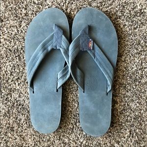 Blue rainbow flip flops